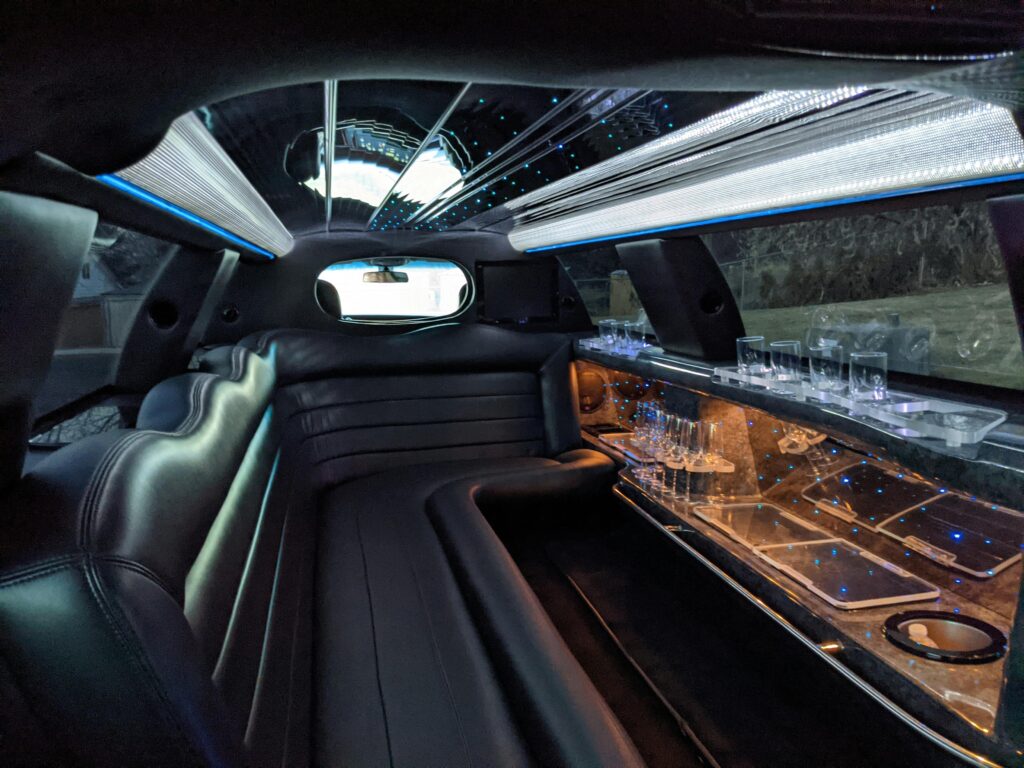 pexels-photo-9151813-9151813 Explore the plush interior of a luxury limousine featuring ambient lighting and comfortable seating.